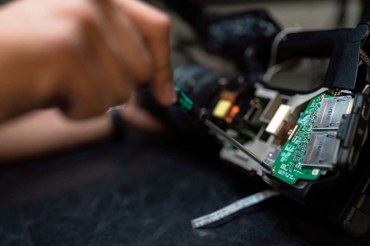 Engineer working on an embedded electronic device at a test bench