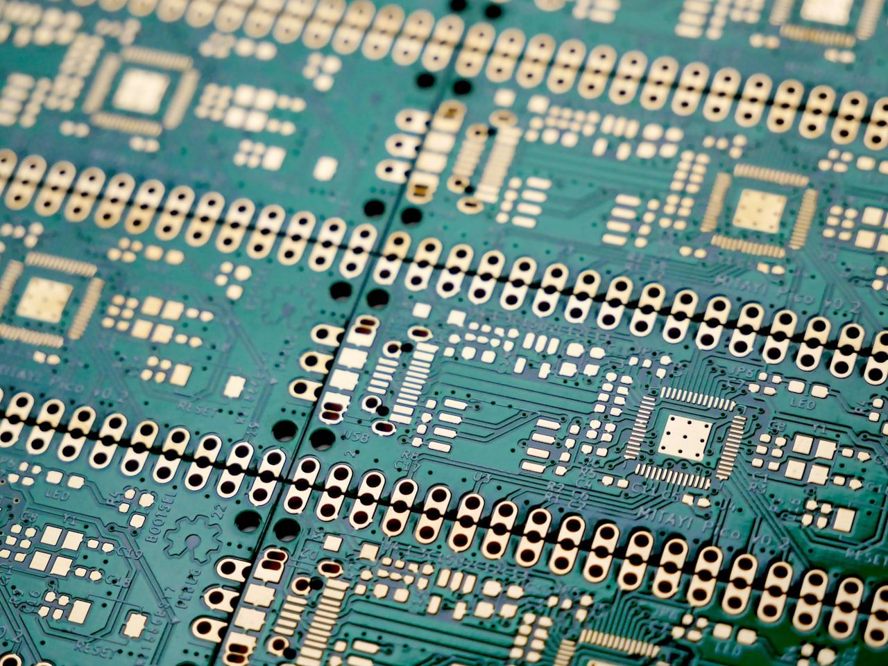 Bare printed circuit board showing high-density traces